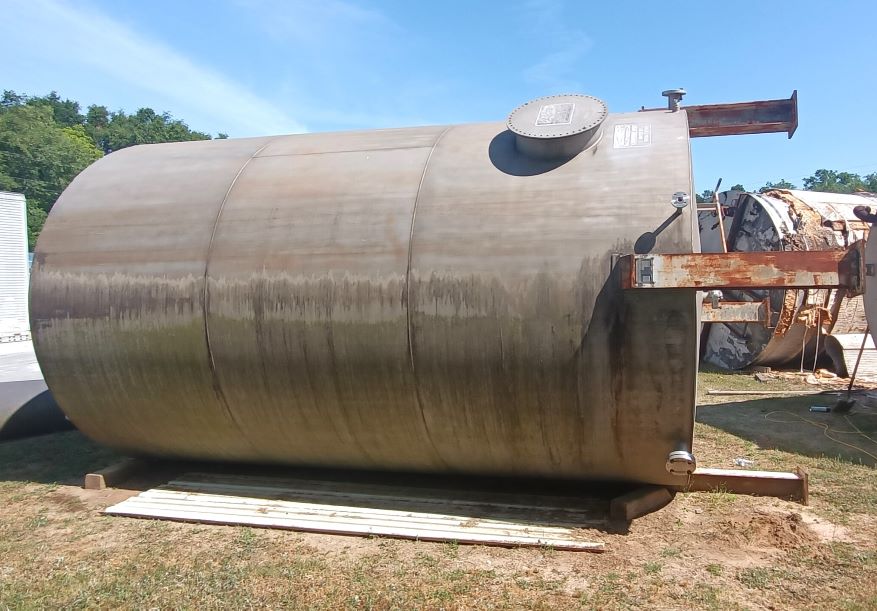 Used 9,400 Gallon Stainless Steel Cone bottom Tank with internal coils. Mounted on 4 carbon steel I-beam legs.  4 loops of 2” heating coils at the bottom.  Diameter is 120”, tank sidewall height 192.5”, legs are 36” and total height from leg bottom to top flanges is ~240”.  0.25” thick bottom, 0.187” thick sides and top.  
Ports: Top – 24” manway & 4 ports @ 3”-150lb 
Side – 24” manway, 1 port @ 3” 150lb located at bottom, 1 port @ 1” 150lb located at the bottom,  heating coil inlet/outlet @ 2” 300lb
Bottom – 3” 150lb on center


